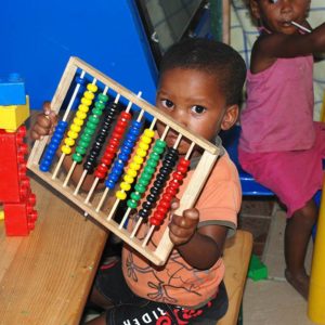 Child playing with an abacus