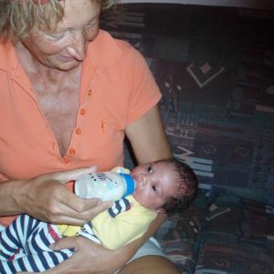 Margrit feeds a very young baby