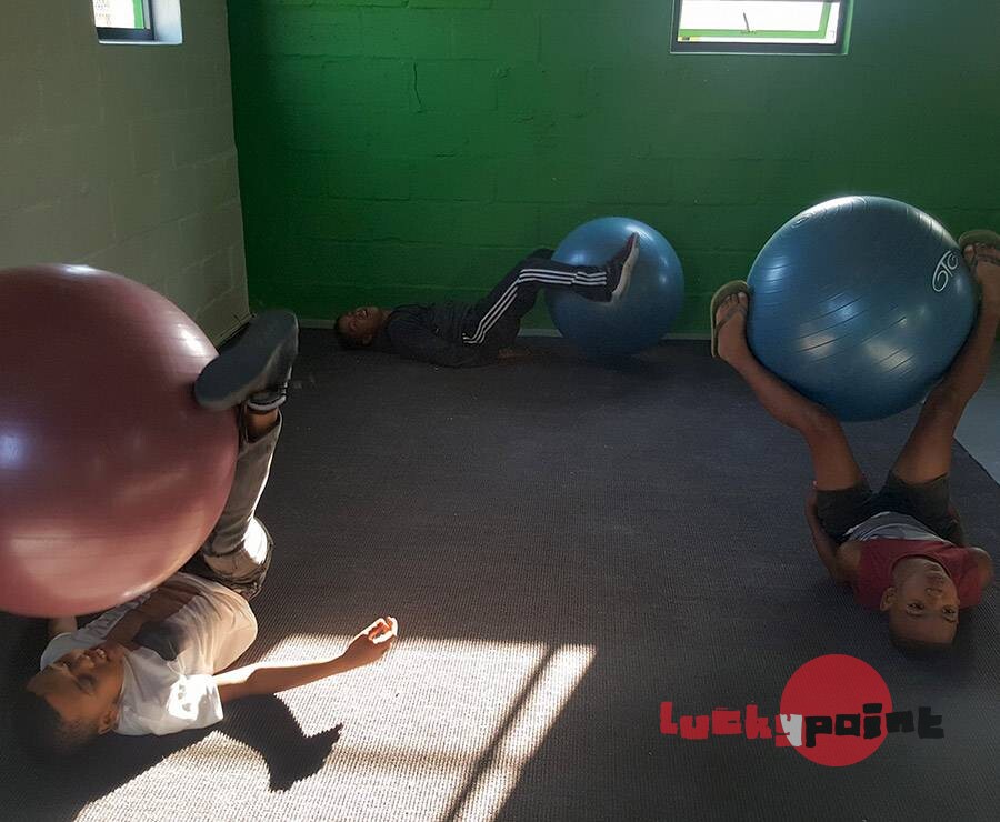 Kids having fun exercising with the Swiss balls