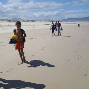 Children walking along the beach from Meerensee to Kleinmond on an outing